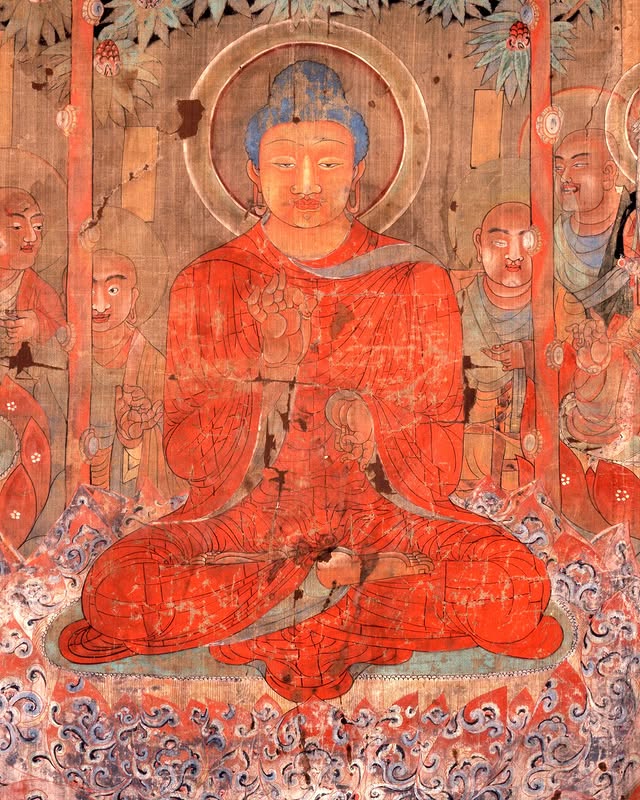 A vibrant ancient mural depicting a seated figure in red robes surrounded by smaller figures, with intricate floral designs at the top.