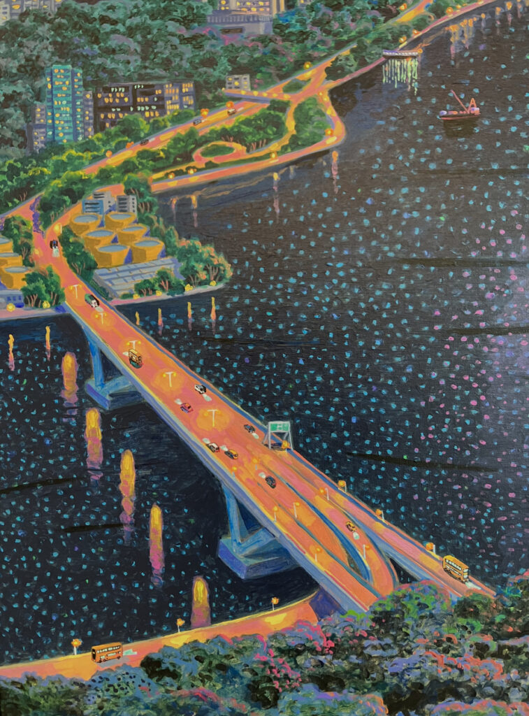 A vibrant nighttime cityscape featuring a bridge over shimmering water, with colorful vehicle lights and lush surrounding greenery.