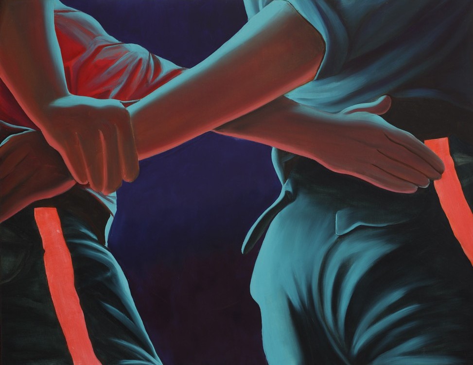 Two hands grasp waistlines, one in a red shirt and the other in a blue, against a deep purple background, conveying intimacy.