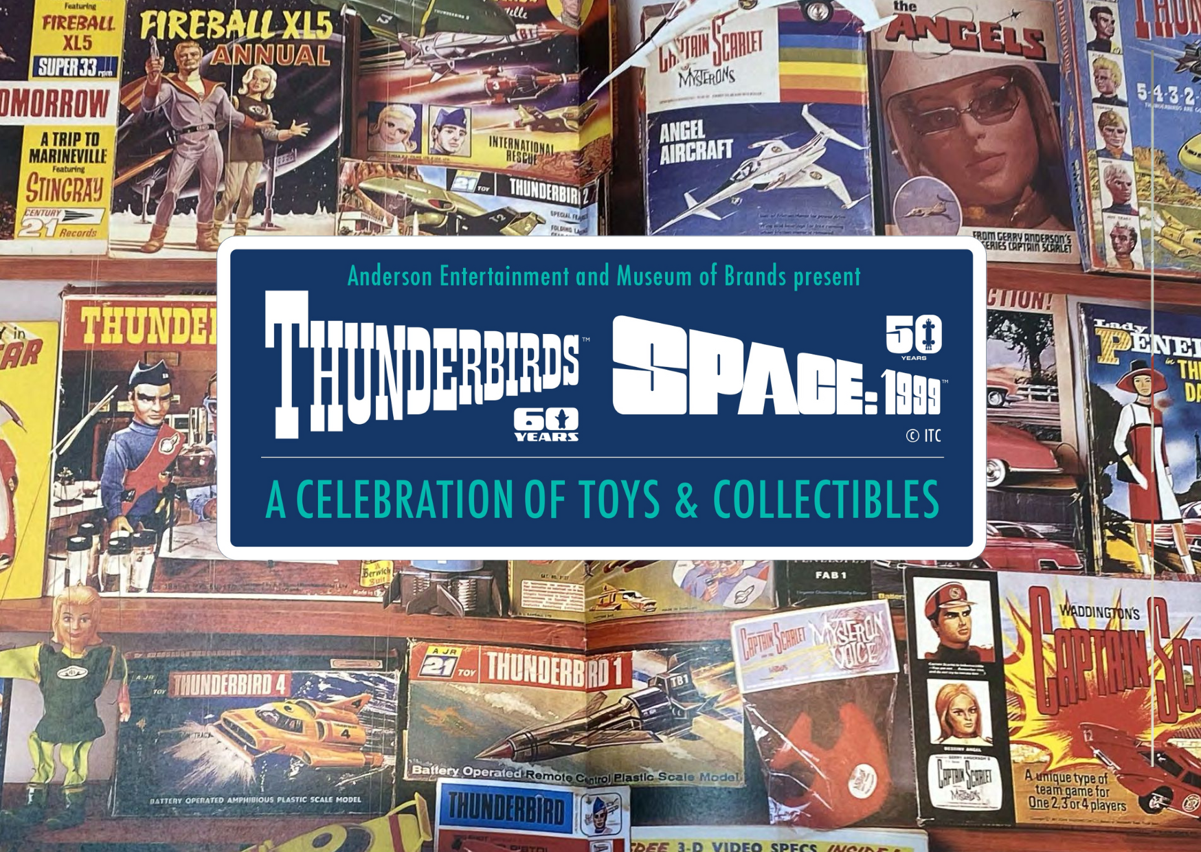 A colorful display of various toys, including models like the FIRERALL, FIREBALL XL5, and ANGELS X15. The scene features a collection promoting "SUPER 33 ANNUAL" alongside memorabilia from classic television shows and films, specifically highlighting items from the THUNDERBIRDS series. In the background, there are references to an exhibition called "A CELEBRATION OF TOYS & COLLECTIBLES." The arrangement is visually appealing with vibrant colors and engaging text aimed at capturing the attention of potential