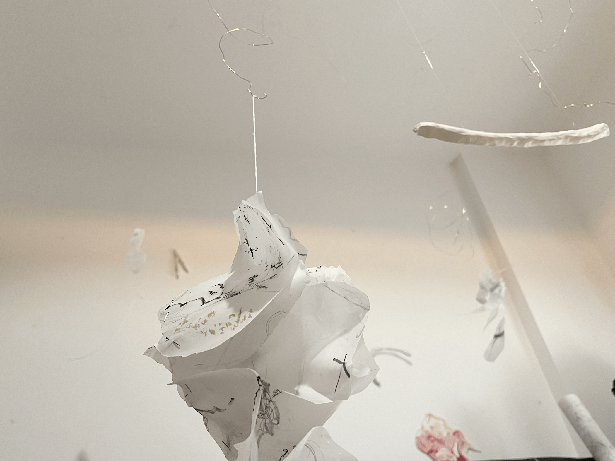 A white piece of paper with artistic splashes of color, possibly depicting a creative concept or design.