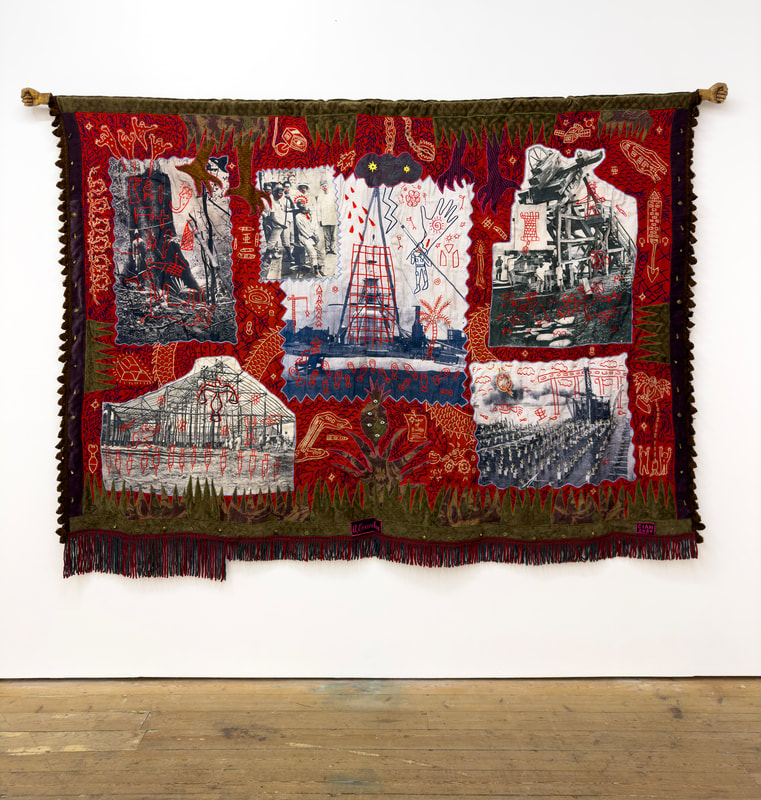 A textile artwork featuring vivid red and green patterns, incorporating historical images and symbols related to oil exploration and industry.